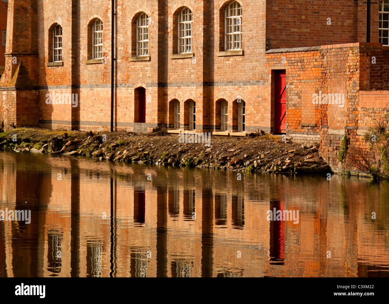 Buildings reflected in Nottingham city centre canal England UK Stock Photo
