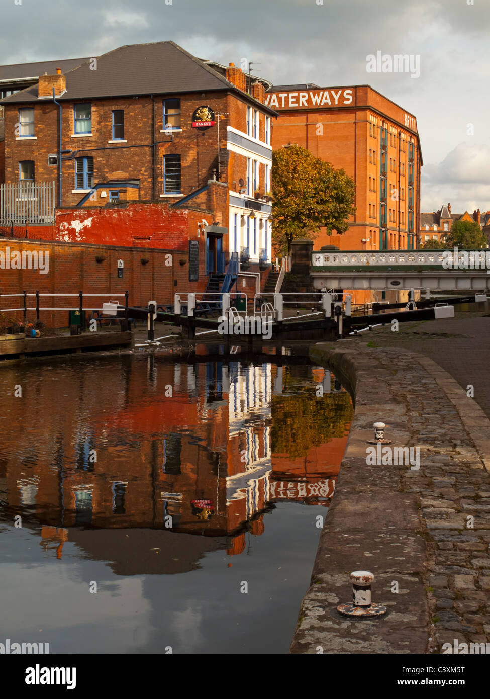Reflection of buildings near lock in Nottingham city centre canal England UK Stock Photo