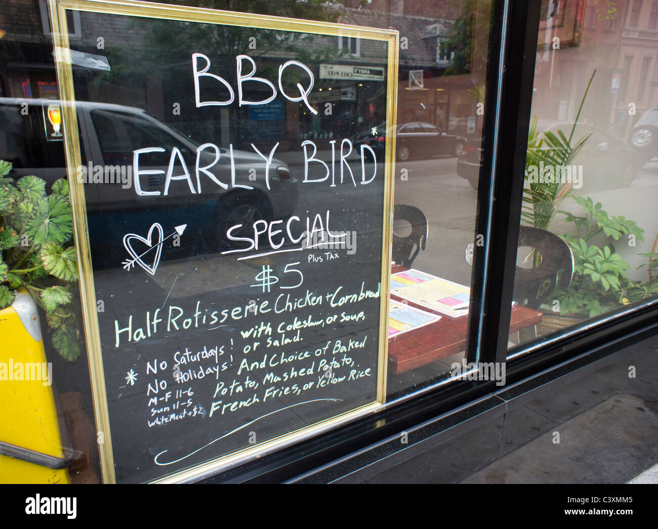 The early bird special is advertised outside a BBQ restaurant in New