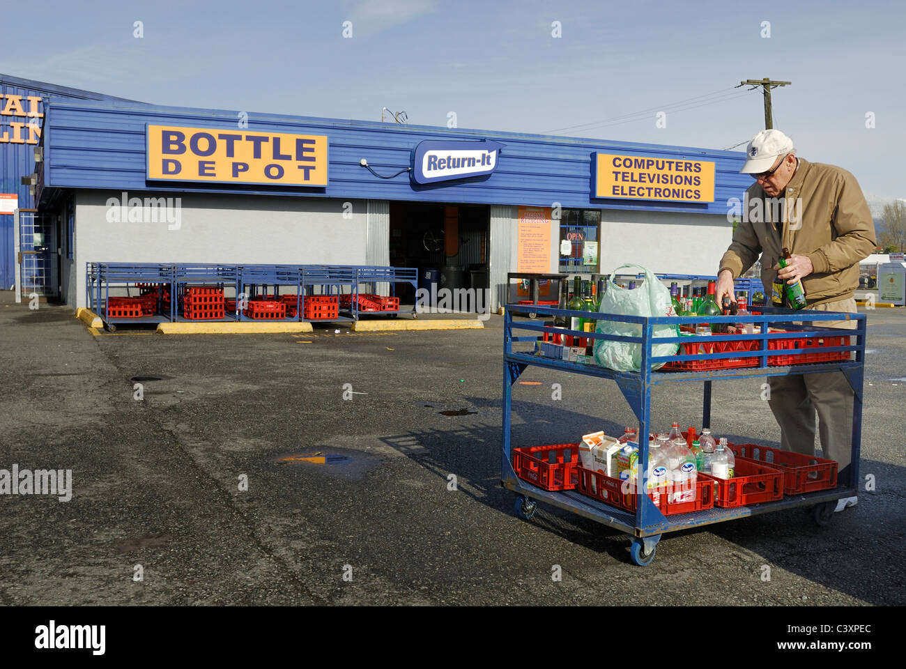 Man organizing his bottles on a cart before taking them into one of