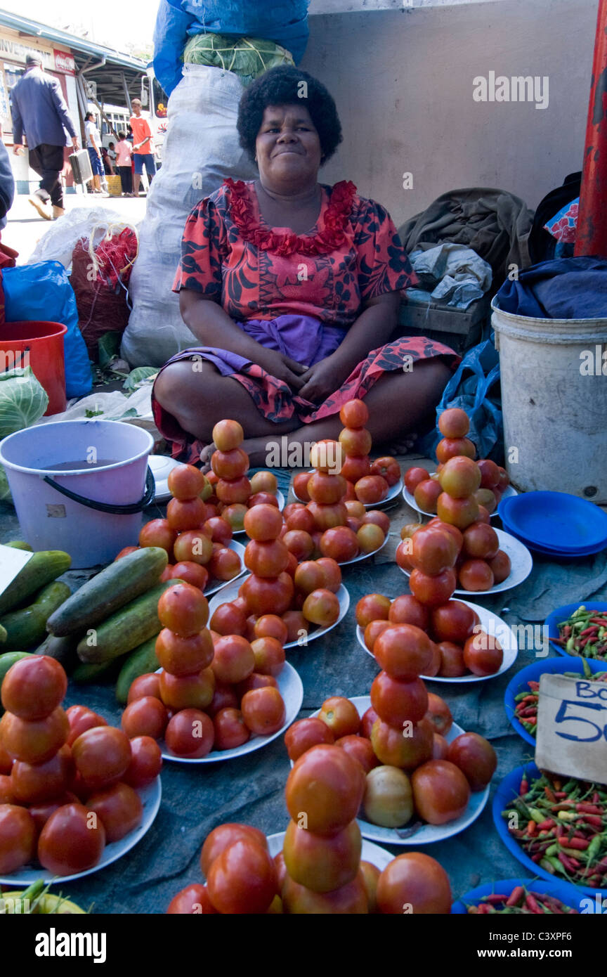 Produce vendors sell their goods Stock Photo Alamy