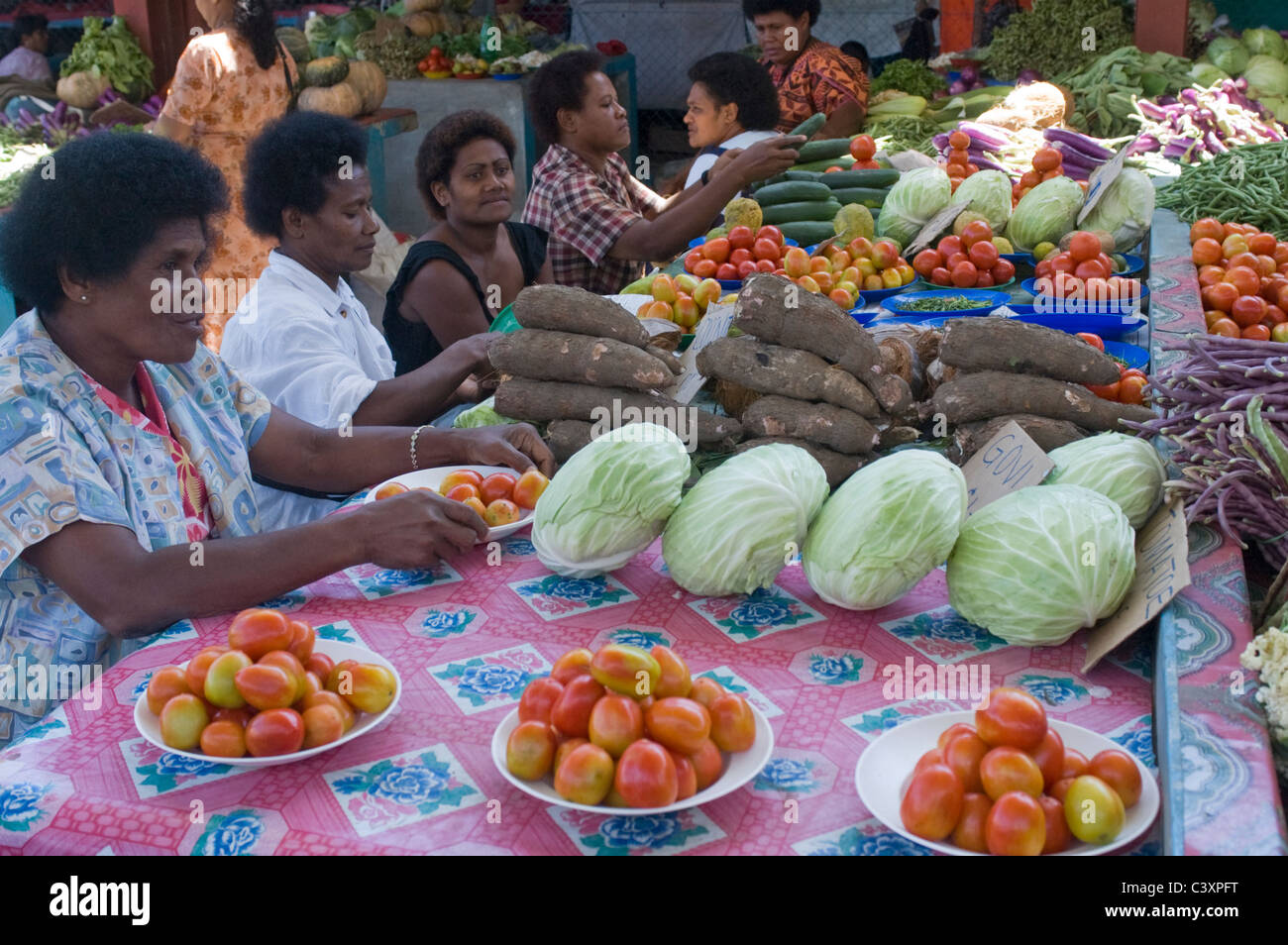 Produce vendors sell their goods Stock Photo Alamy