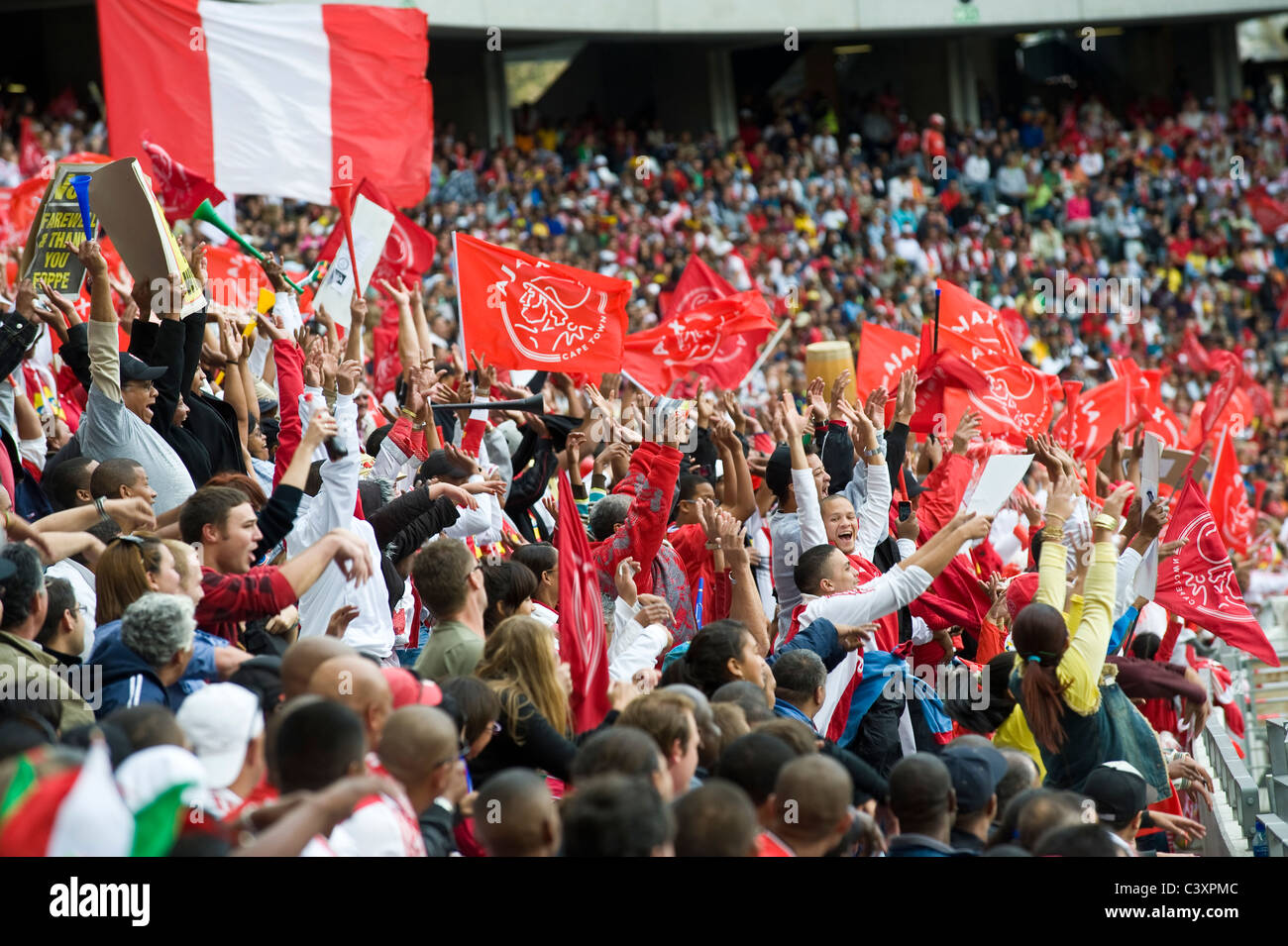 Supporters of Ajax Cape Town Football Club cheering in Cape Town ...