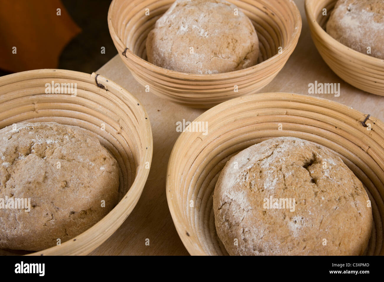 Fresh dough in a commercial bakery prepared for cooking into bread loaves Stock Photo