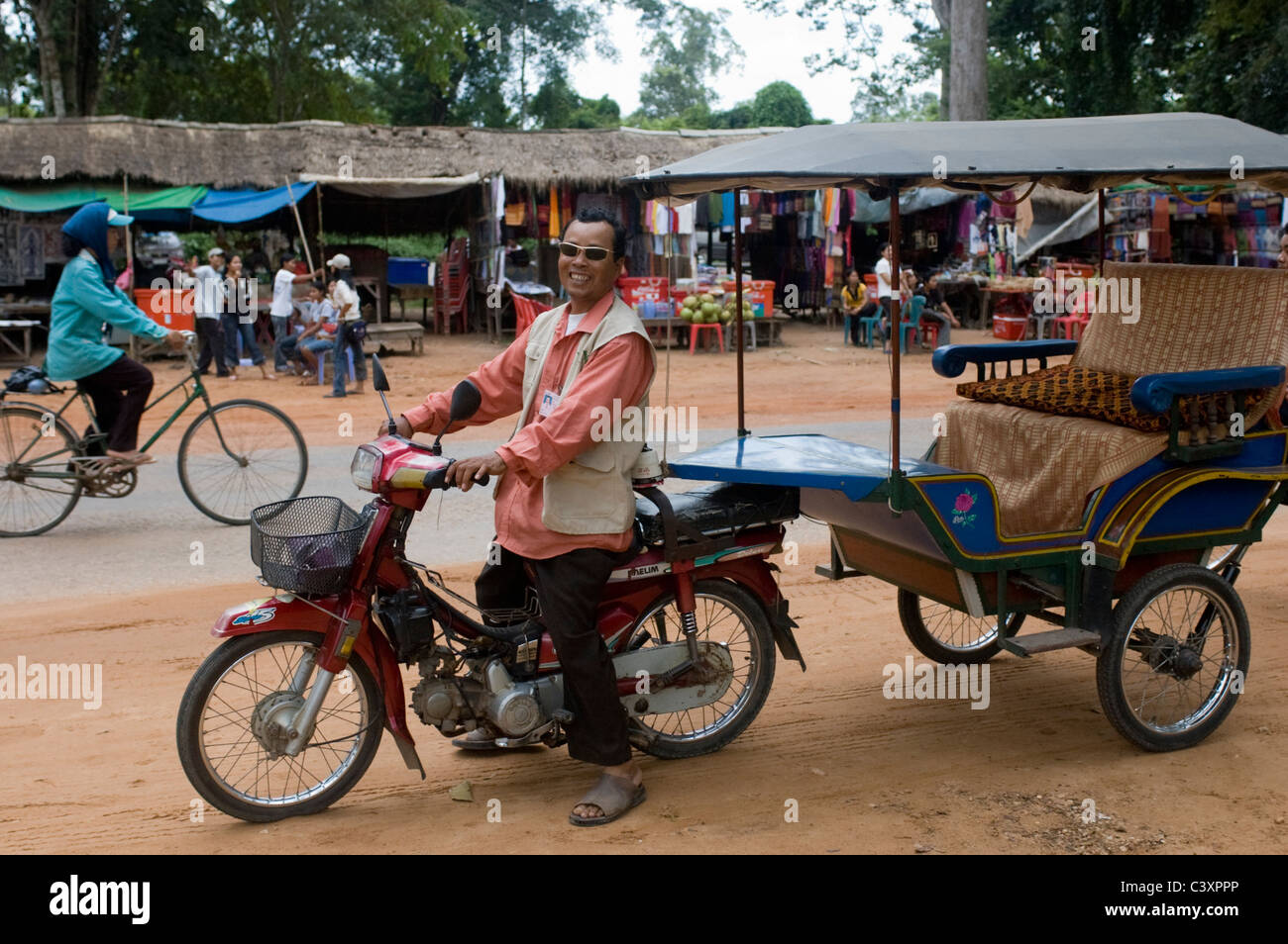 A Remorque-moto driver at the Temples of Angkor. Stock Photo