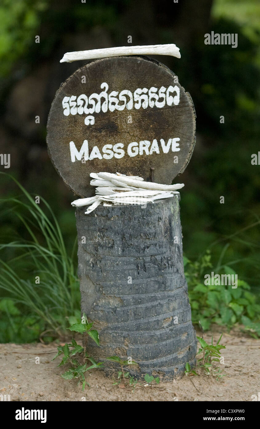 A mass grave sign with human bones at the Killing Fields of Choeung Ek. Stock Photo