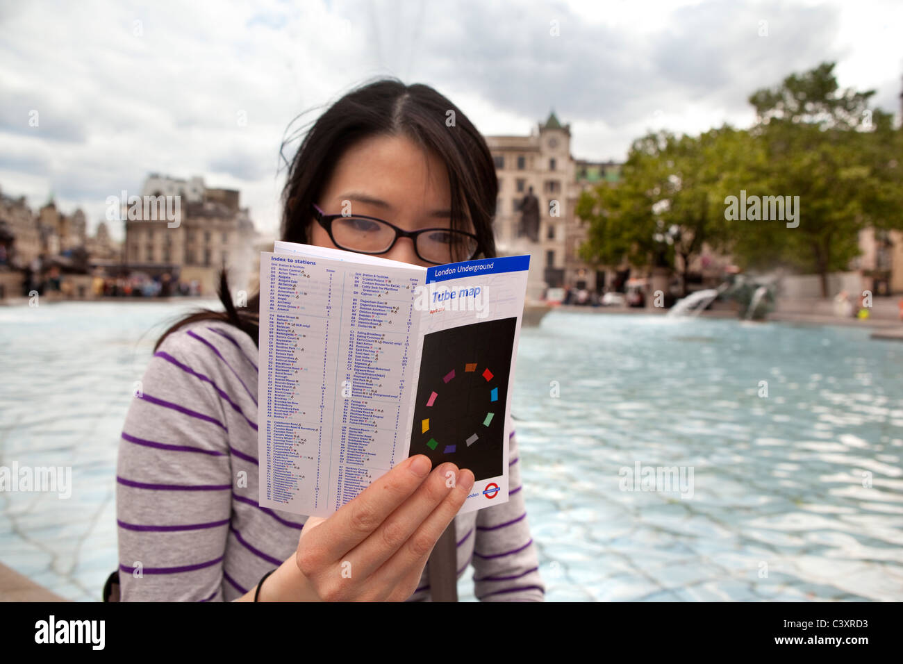 A tourist in Trafalgar Square. Stock Photo