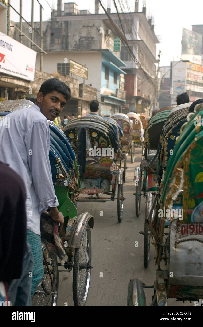 A bicycle rickshaw wallah on the street in Dhaka Stock Photo - Alamy