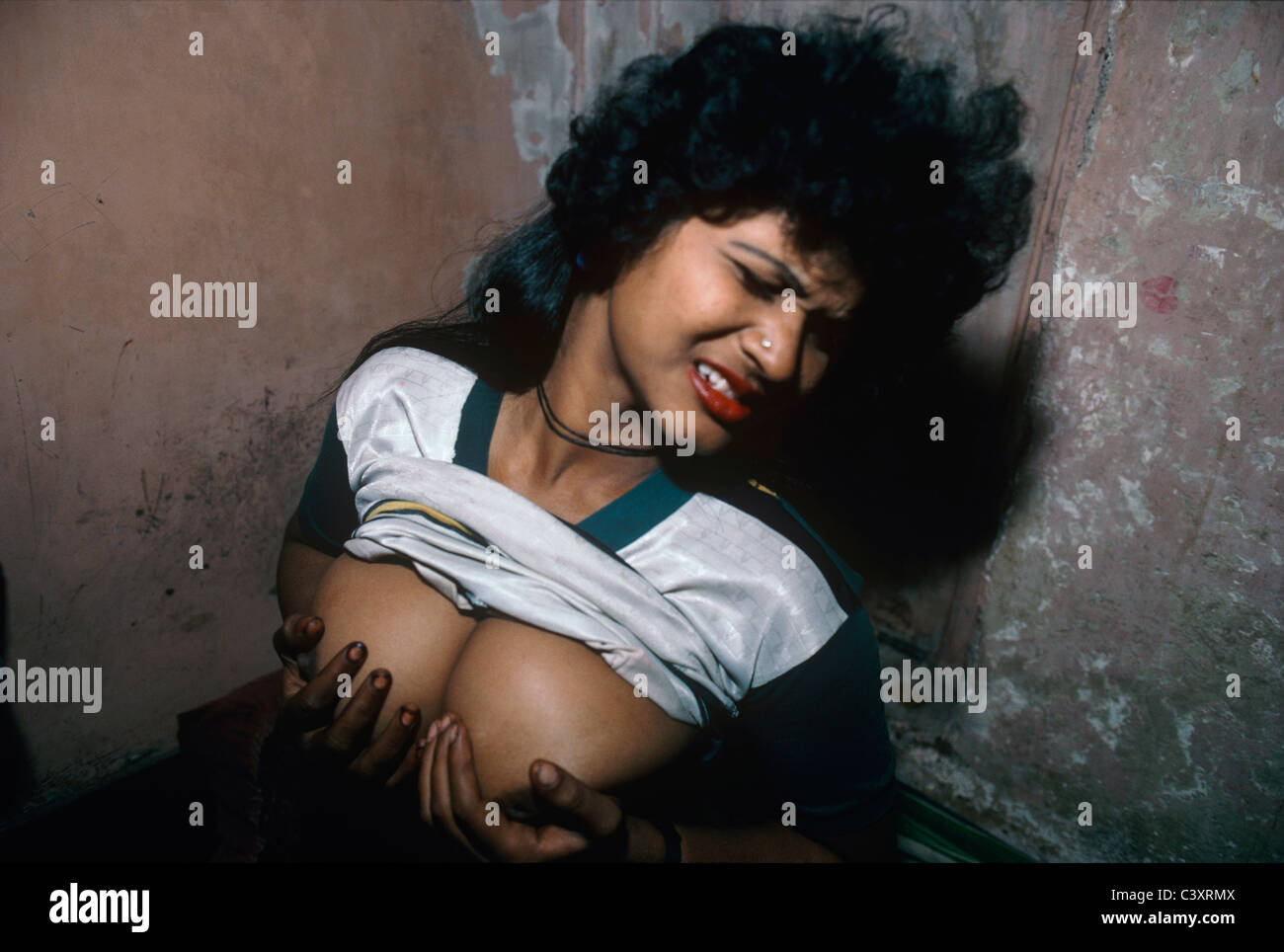 Indian prostitute grasping her breasts at Falkland Road. Bombay, India  Stock Photo - Alamy