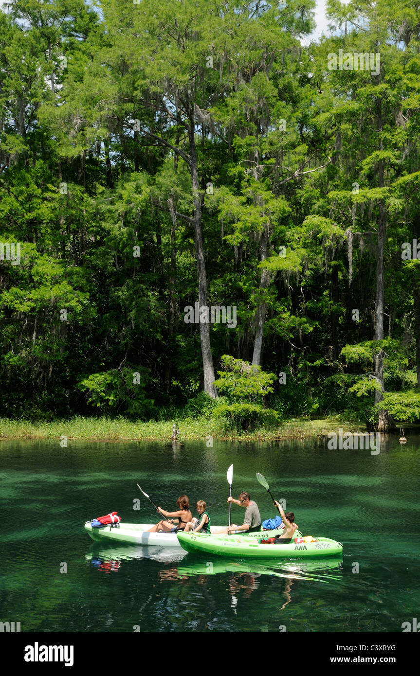 Family kayaking on the Rainbow River at Dunnellon Florida USA Stock
