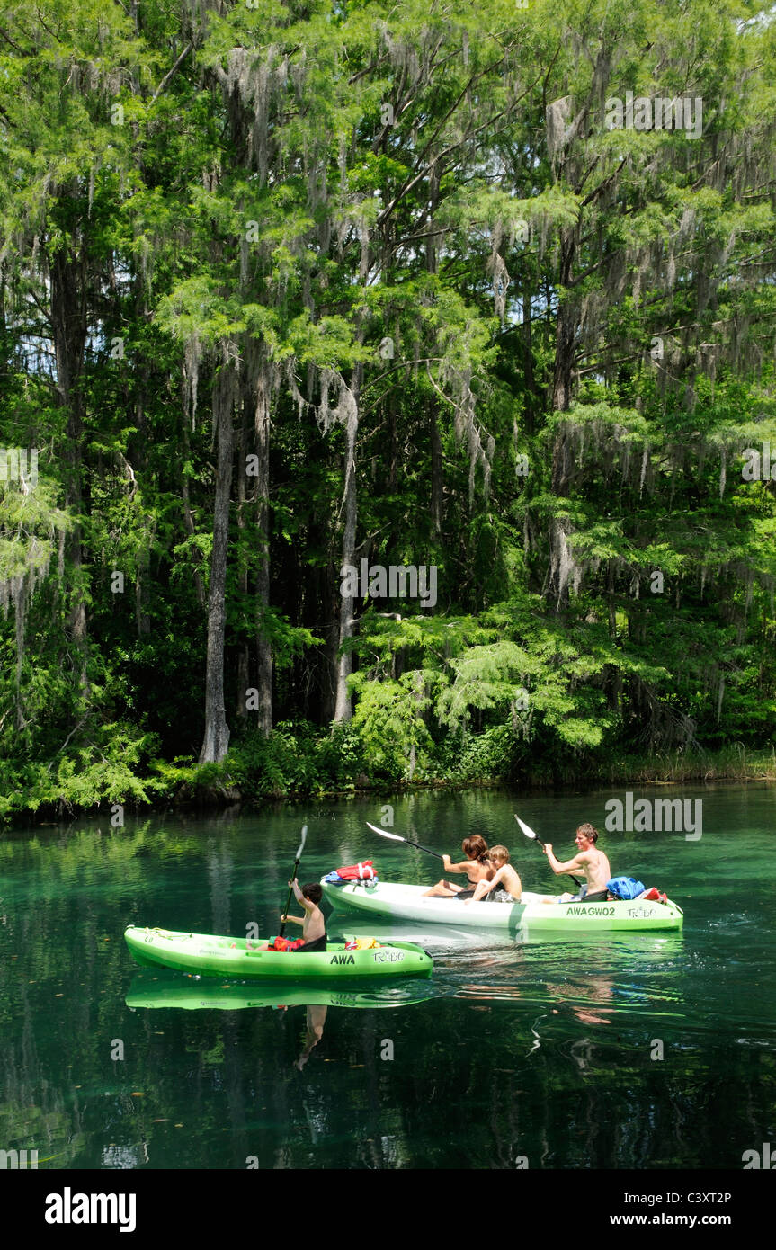 Family kayaking on the Rainbow River at Dunnellon Florida USA Stock Photo