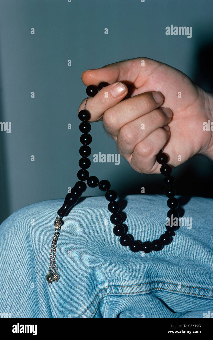 Israeli Secret Service agent shows a radio transmitter and microphone hidden in worry beads. Israel Stock Photo