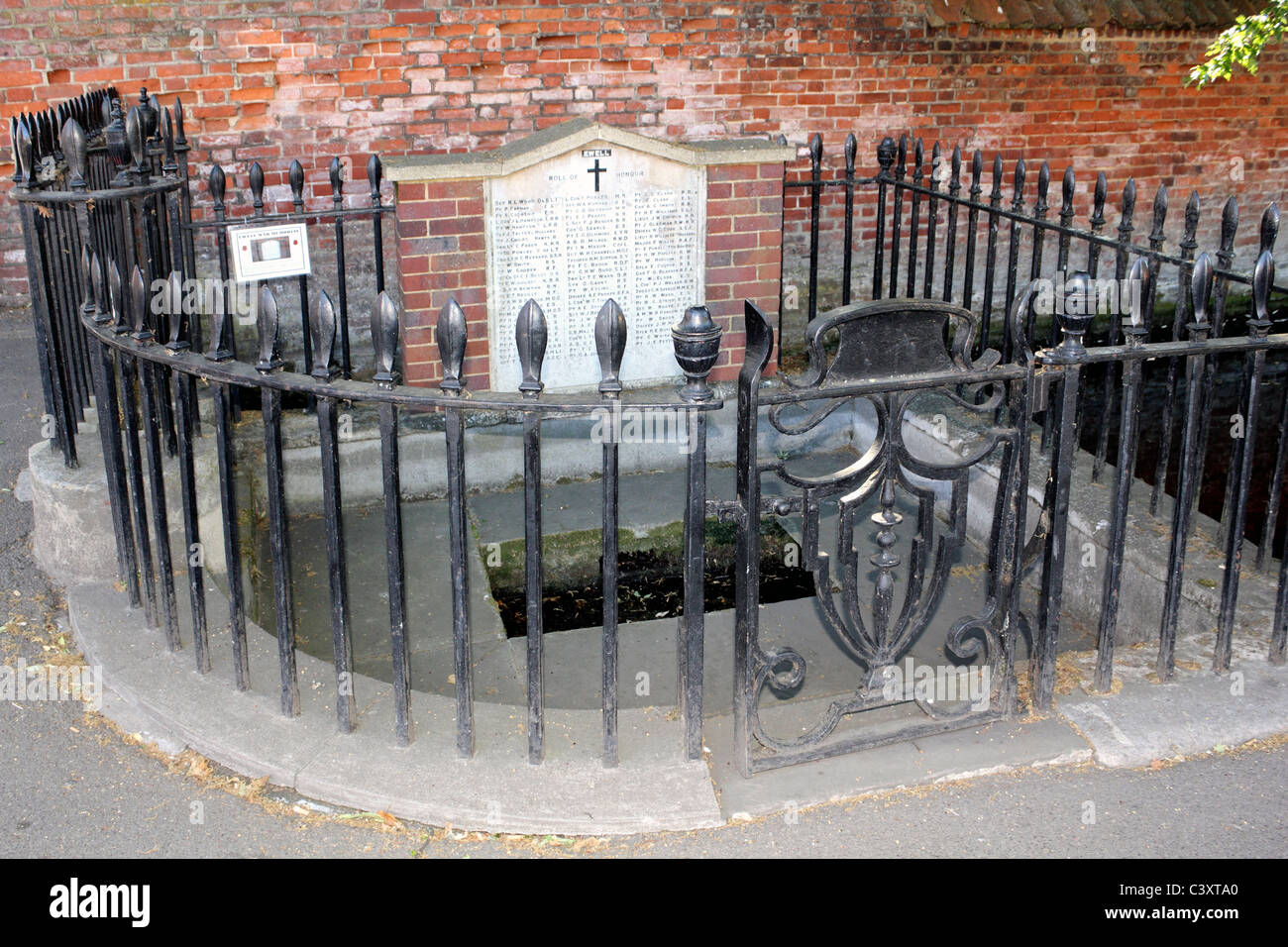The Dipping Well and War Memorial outside Dog Gate entrance to Bourne
