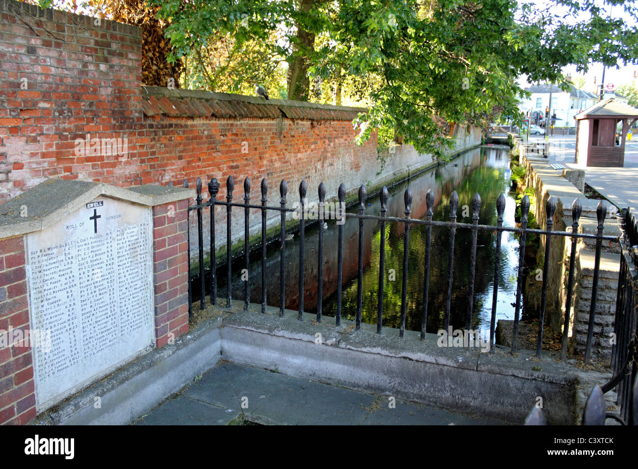 The Dipping Well and War Memorial outside Dog Gate entrance to Bourne