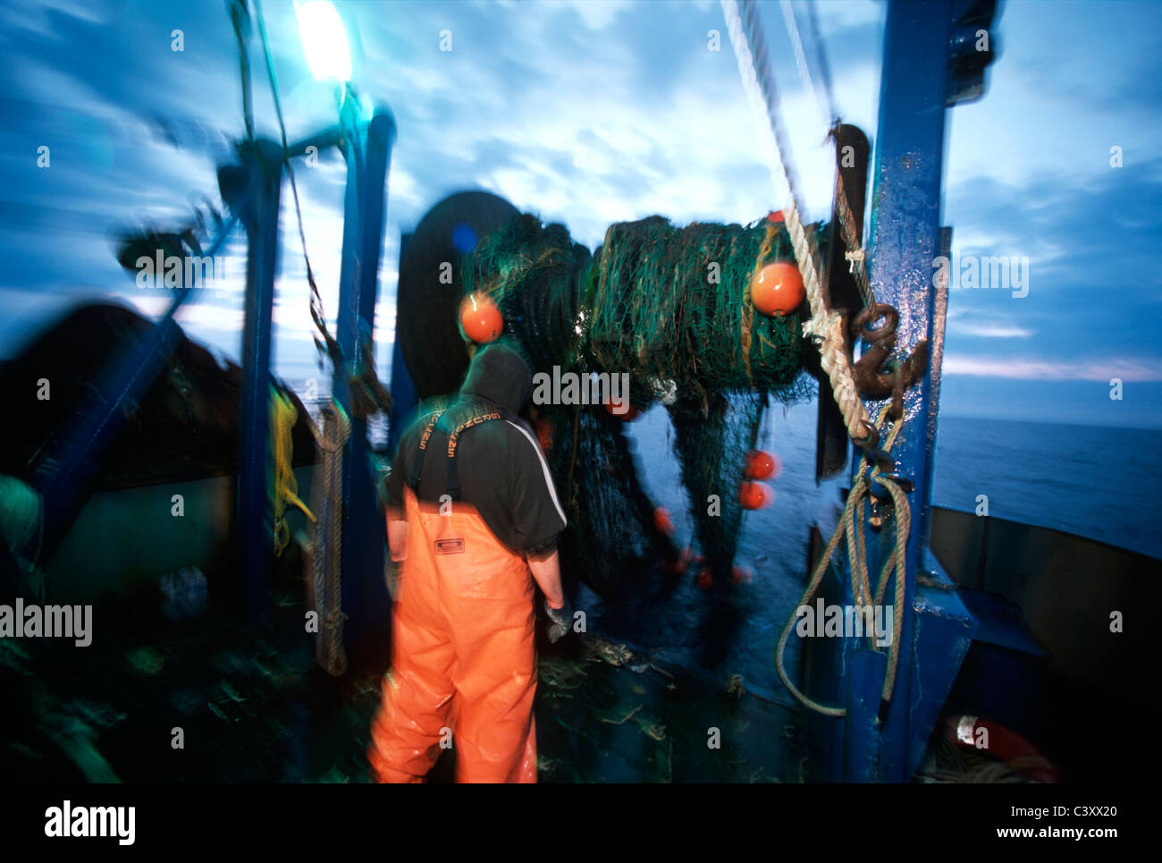 Fishermen hauls in dragger fishing net. Stellwagon Bank, New England, Atlantic Ocean. Stock Photo