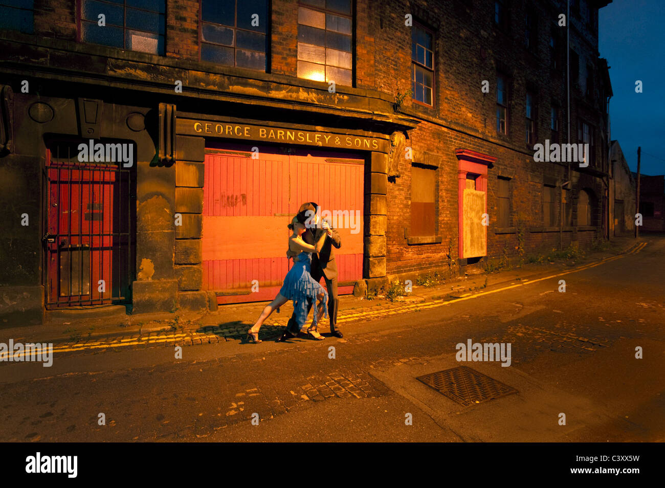 2Tango dancers at night at Kelham Island's industrial quarter  Sheffield Stock Photo