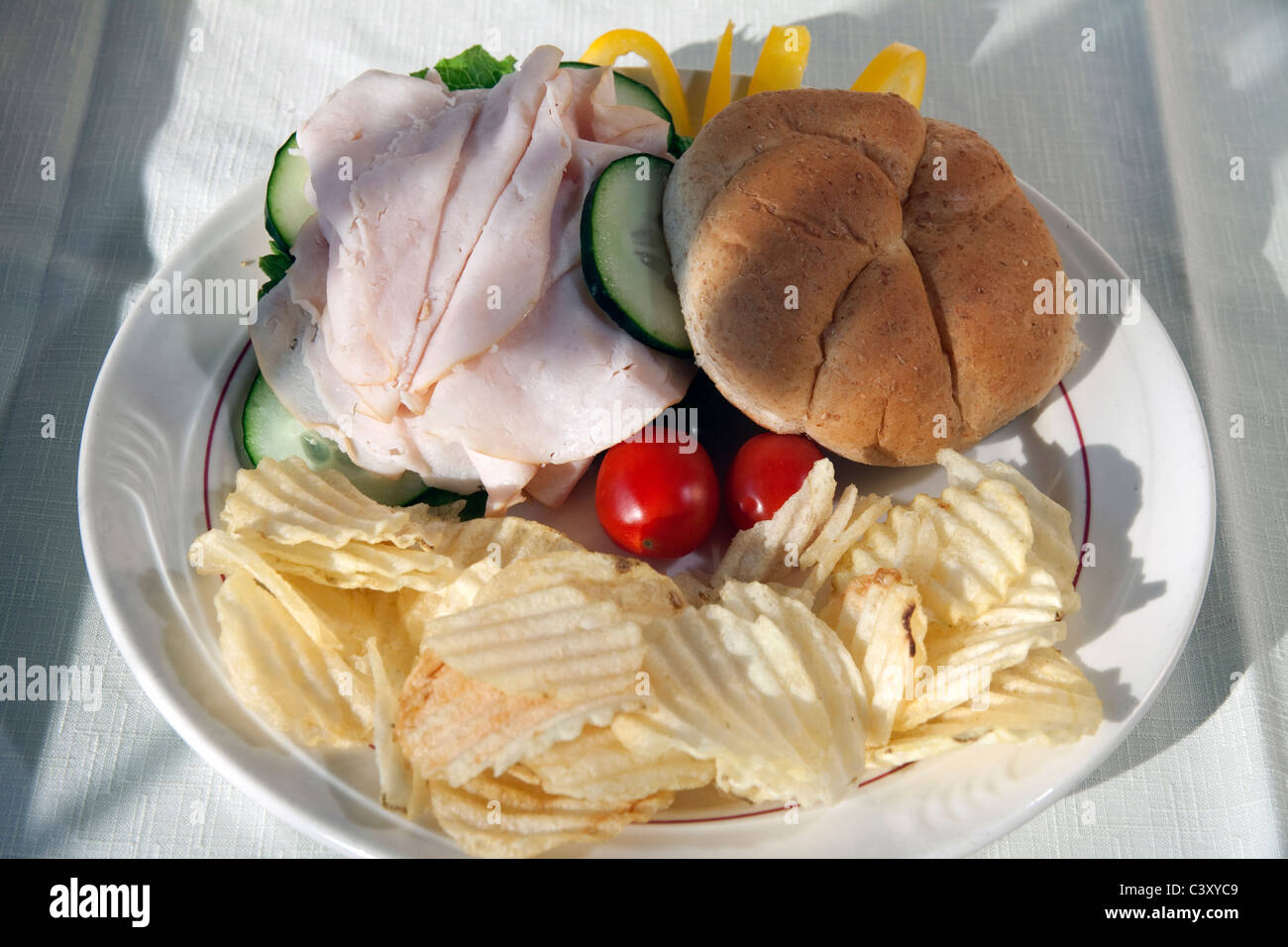 Turkey Sandwich with potato chips and vegetables USA Stock Photo Alamy