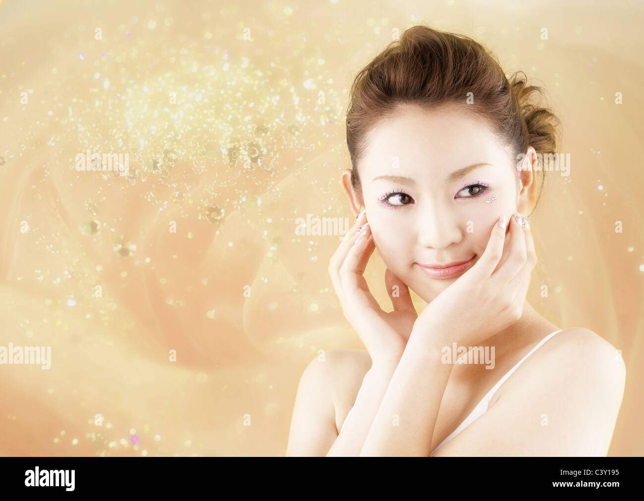 Young woman with hands on cheeks Stock Photo - Alamy