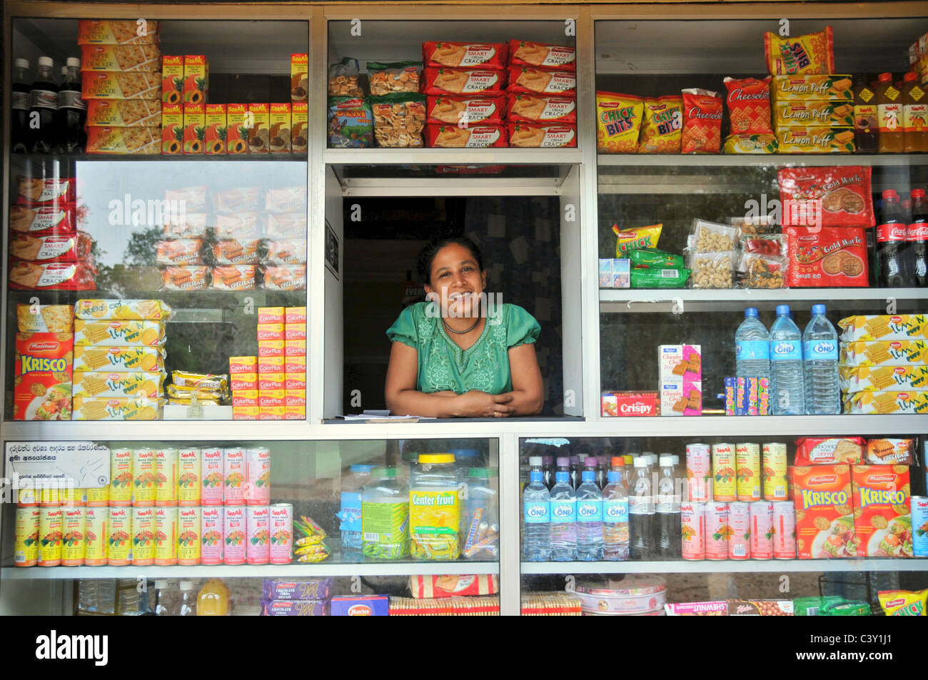 Pretty woman trader in kiosk Anuradhapura Sri Lanka Stock Photo
