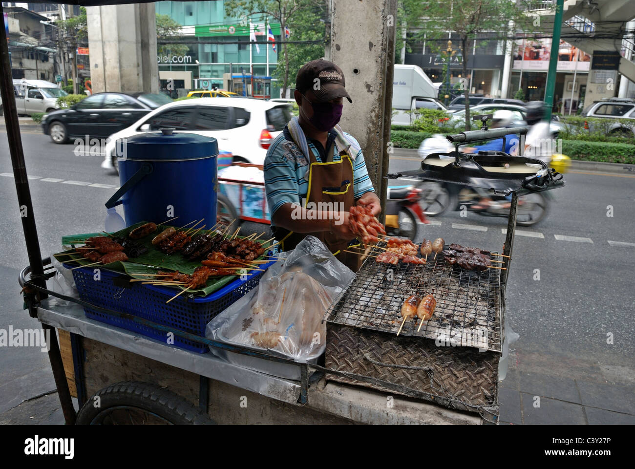 Street food vendor selling meat snacks on the streets of Bangkok Stock