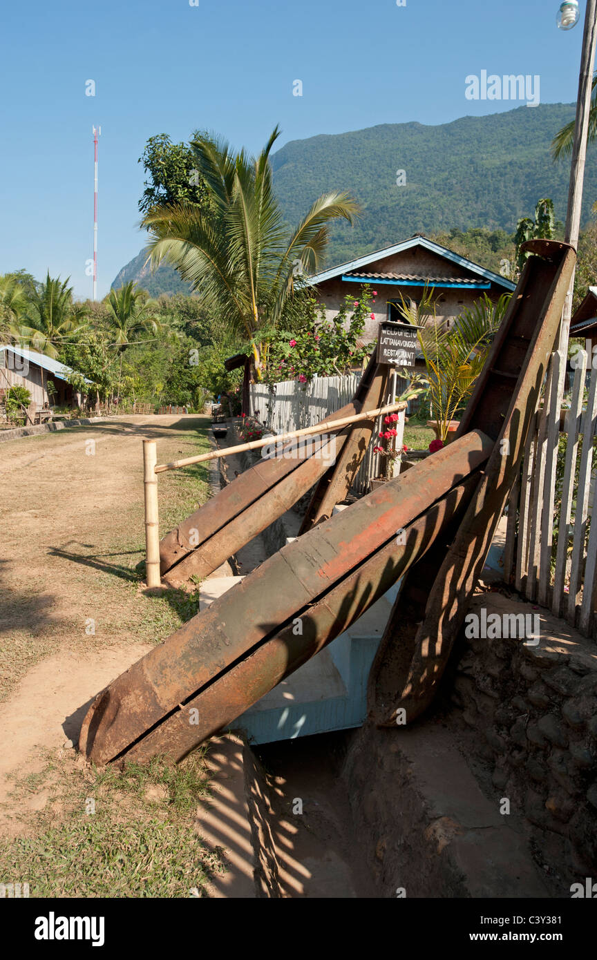 American bomb casings used at gate post in a village in North Eastern Laos in The People's Democratic Republic of Laos Stock Photo