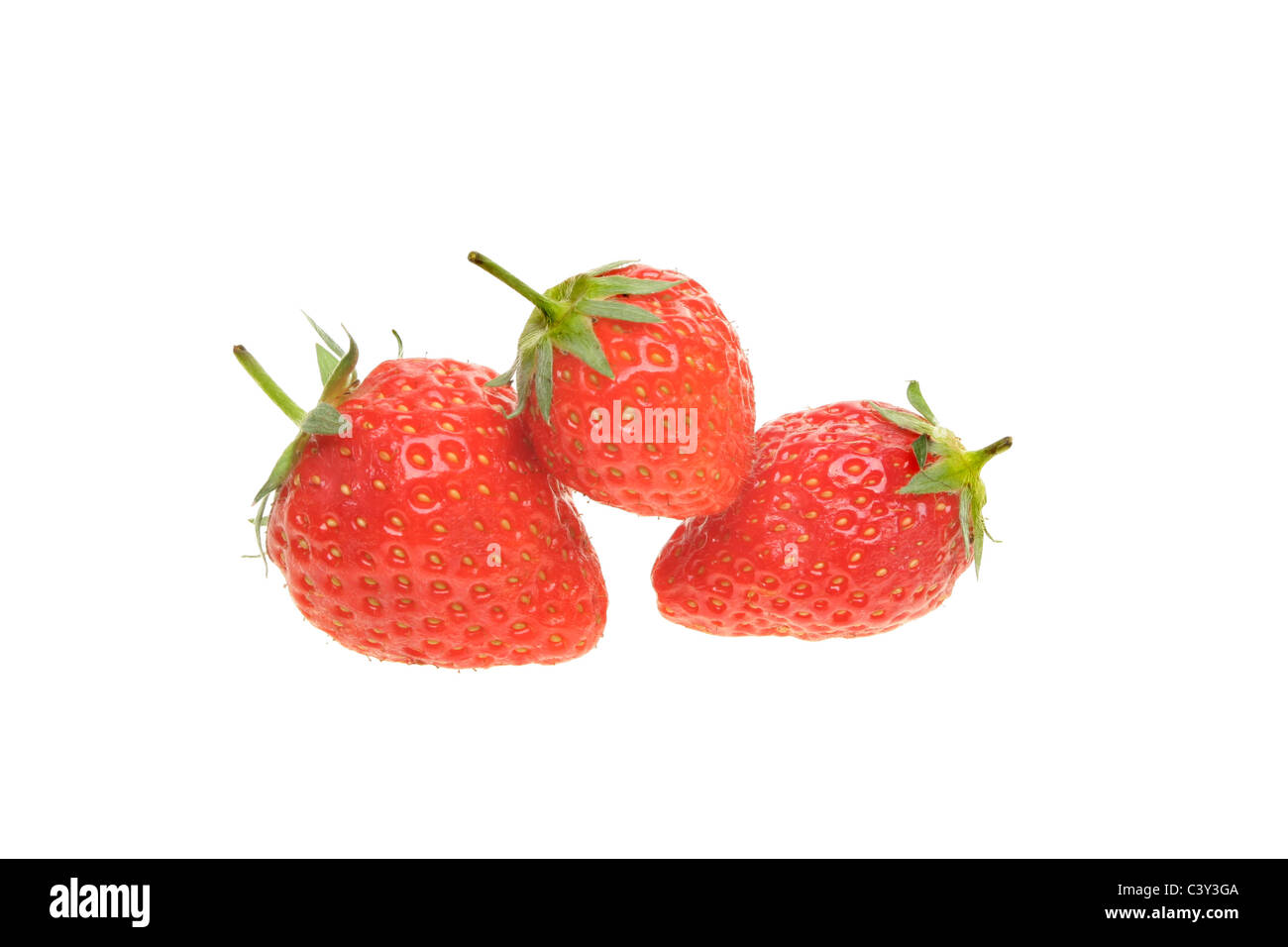 Three fresh ripe strawberries isolated on white Stock Photo