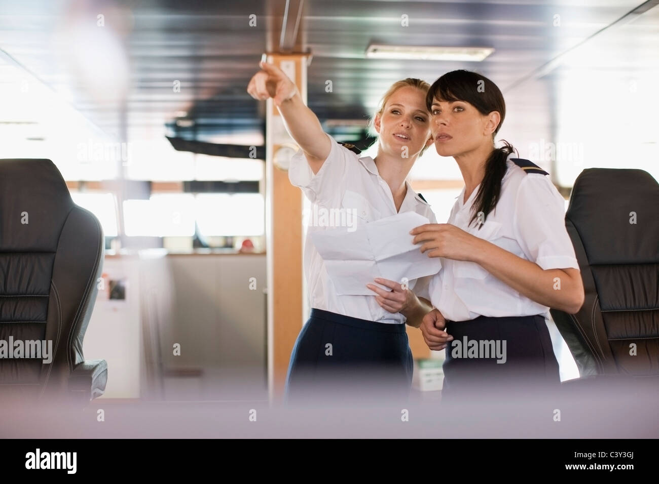 Women at work on a ship Stock Photo