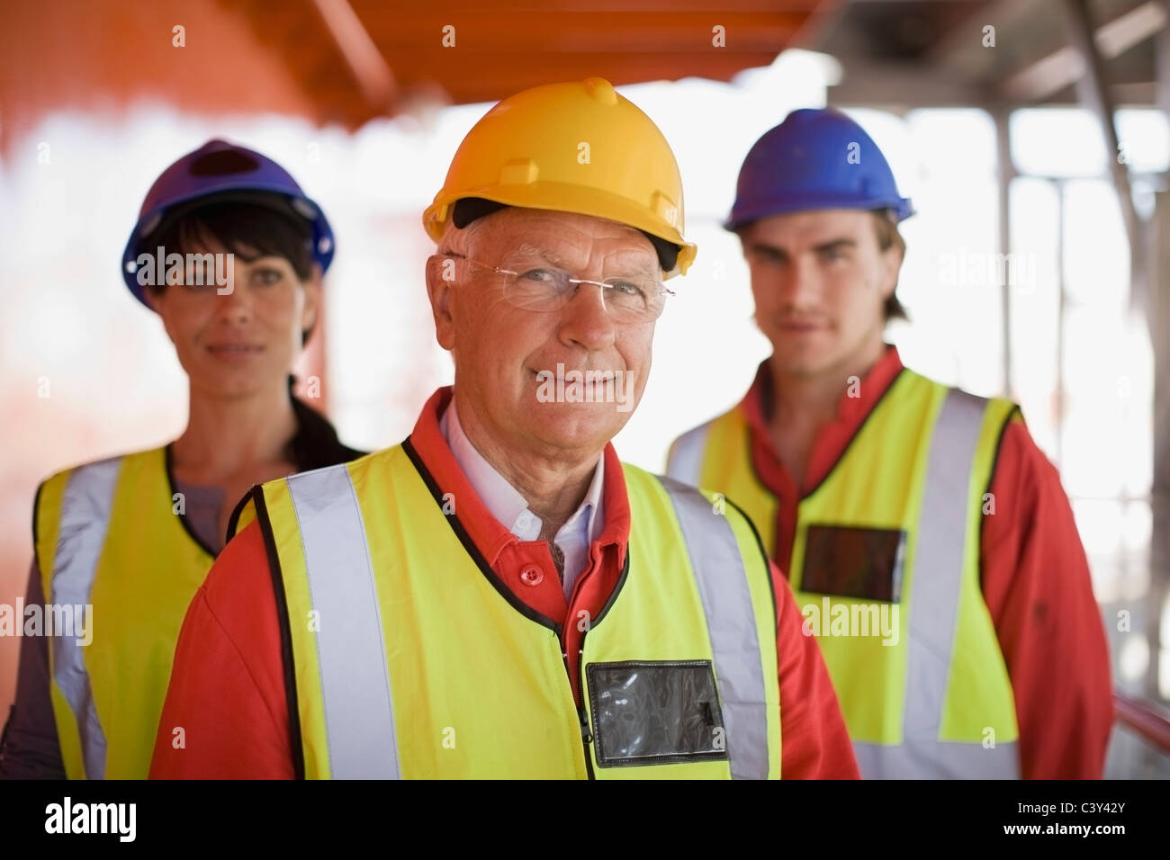Workers on construction site Stock Photo - Alamy