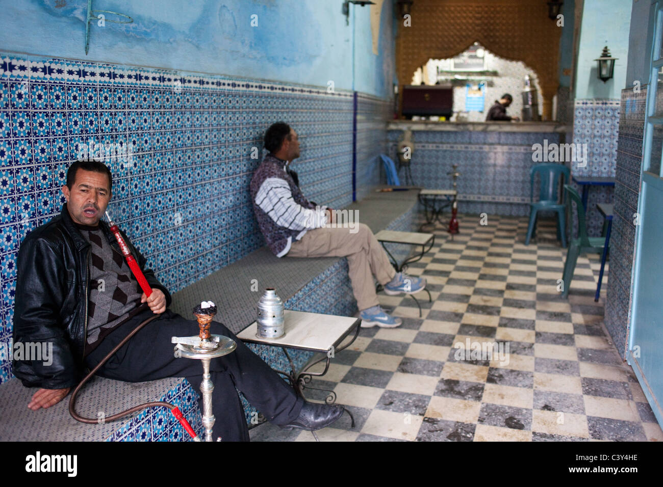 A man smoking shisha in the Turkish Cafe in Kairouan, Tunisia Stock Photo