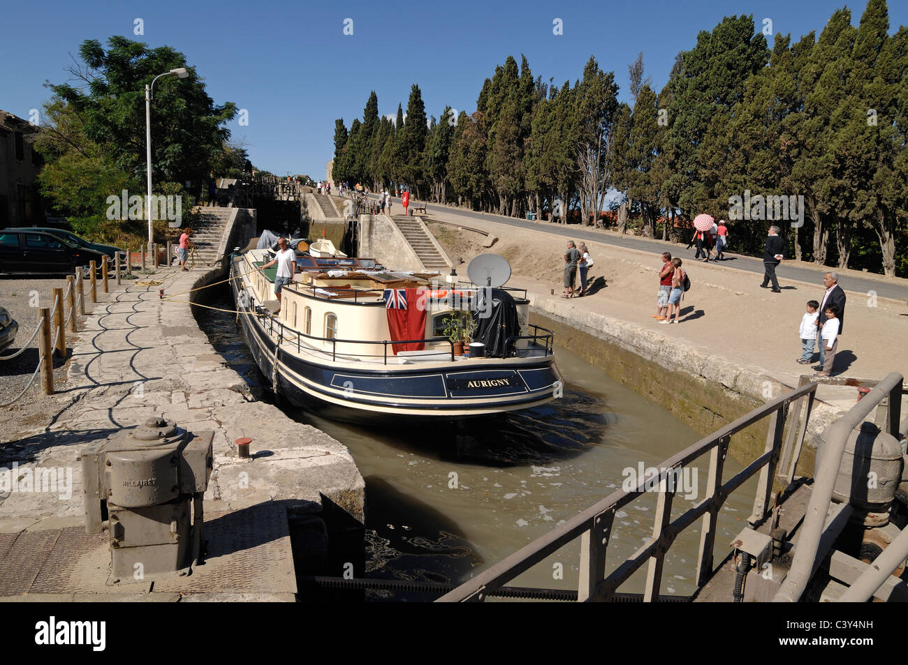 Canal Boat, Longboat, Narrowboat or Widebeam in Lock (the Neuf Ecluses) on the Canal du Midi at Beziers Hérault France Stock Photo