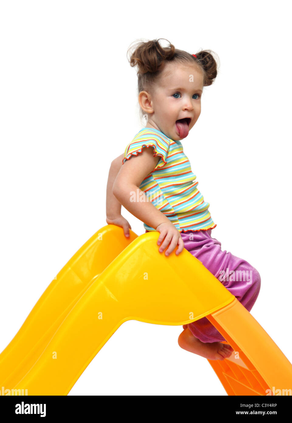 cute little girl on yellow slide - white background Stock Photo - Alamy