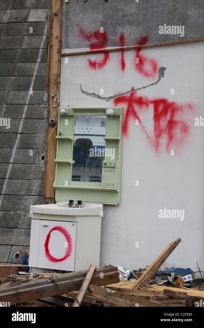 This house was checked and marked by rescue workers on 16th March 2011 Ootsuchi-cho town Iwate Japan Stock Photo