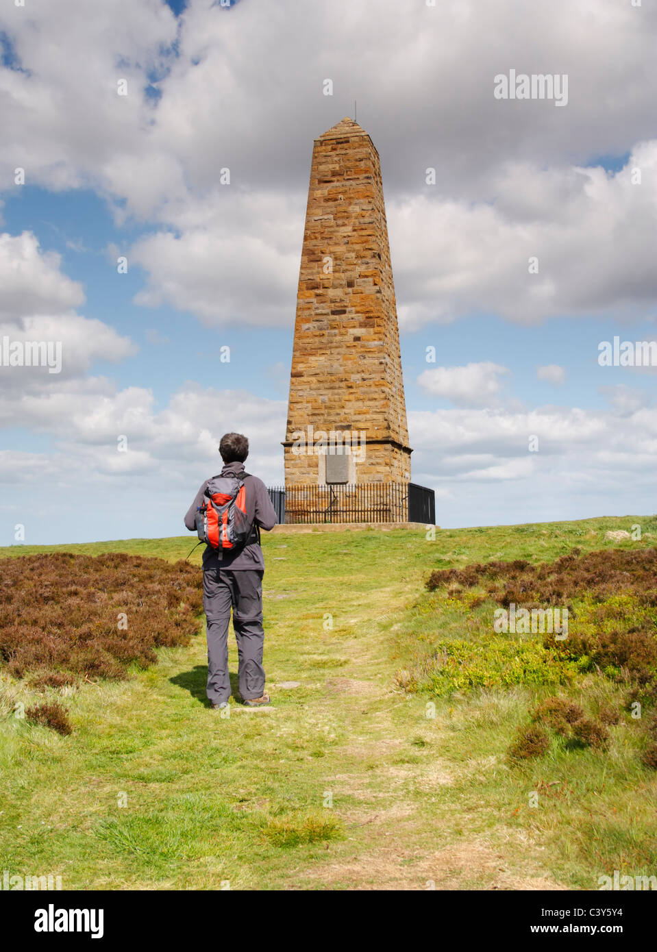 Male hiker near Captain Cook's monument on Easby moor near Great Ayton, North Yorkshire, England Stock Photo