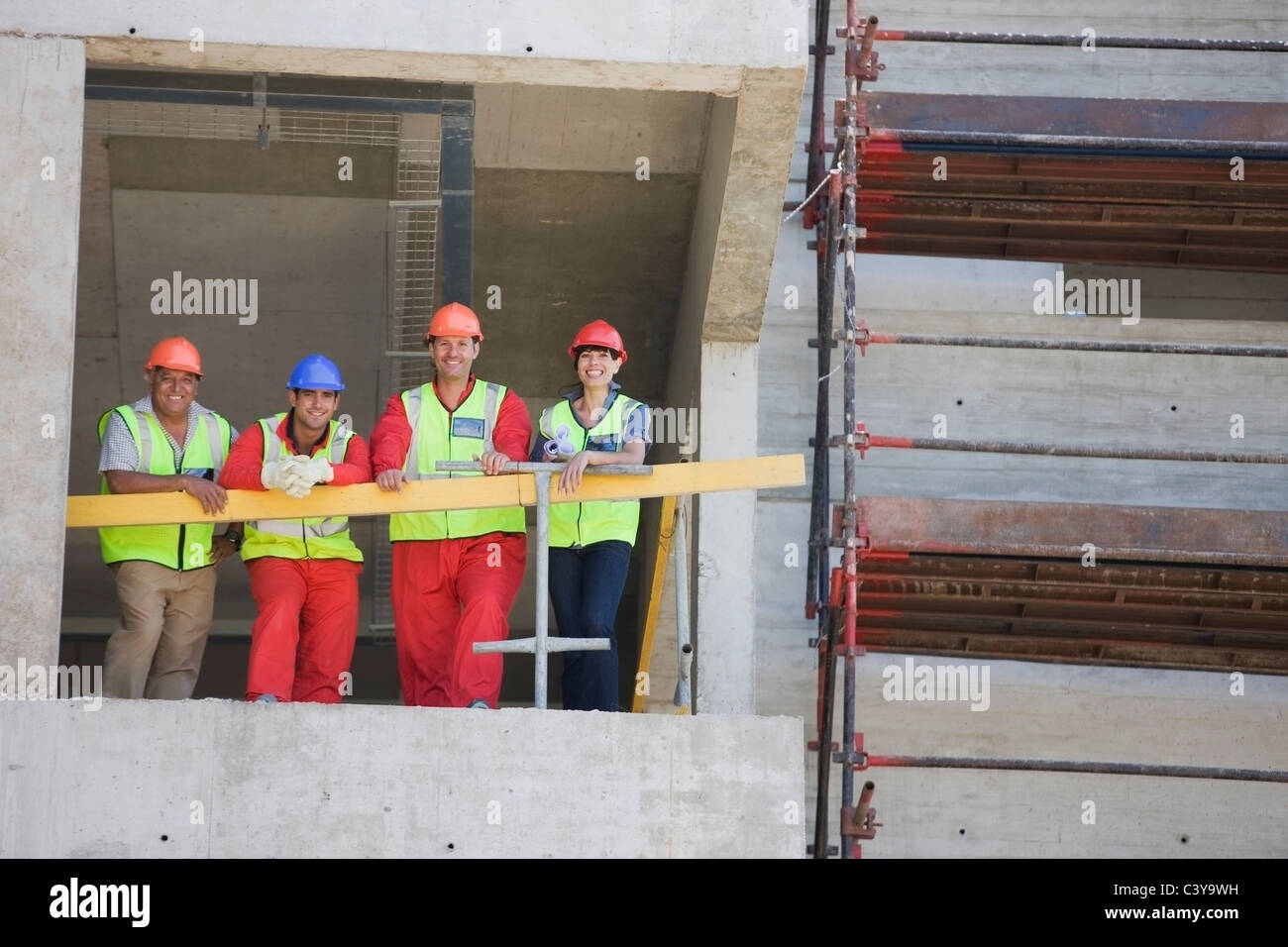 Workers in a shell of building Stock Photo - Alamy