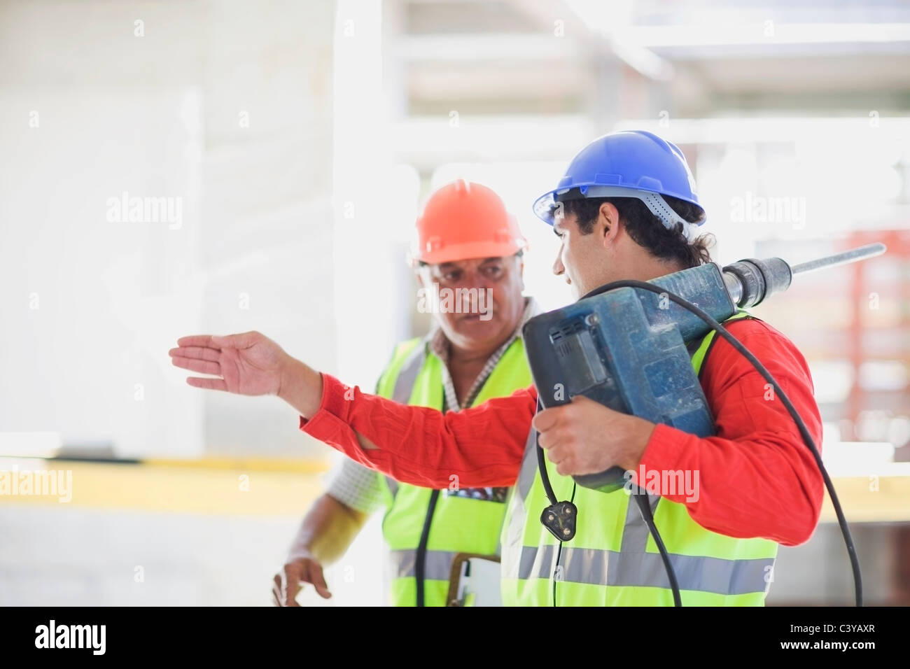Workers with boring machine Stock Photo