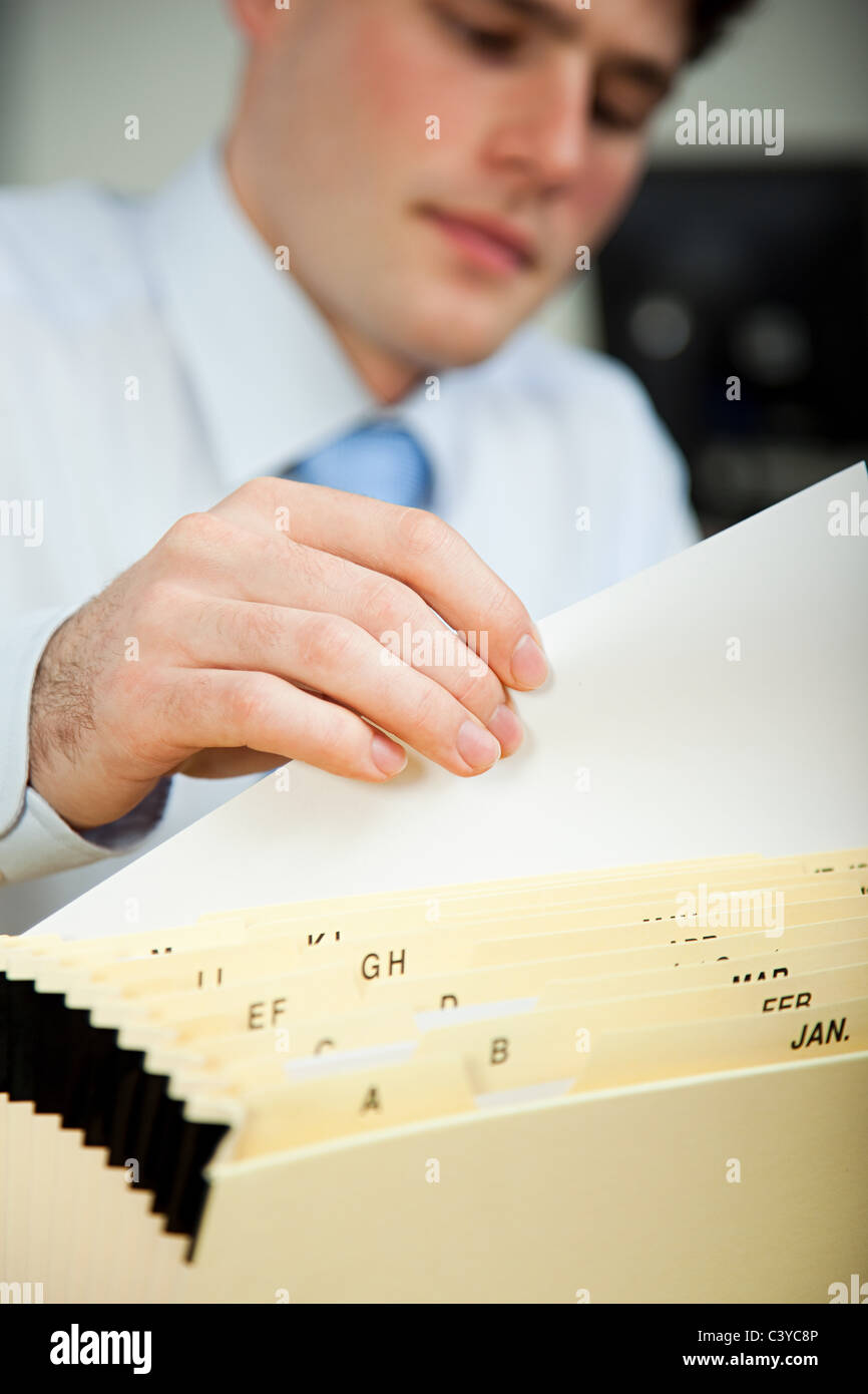 Office Worker Filing Document Stock Photo Alamy