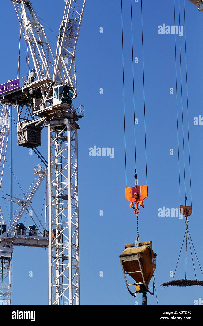Tower crane lifting hopper Stock Photo Alamy