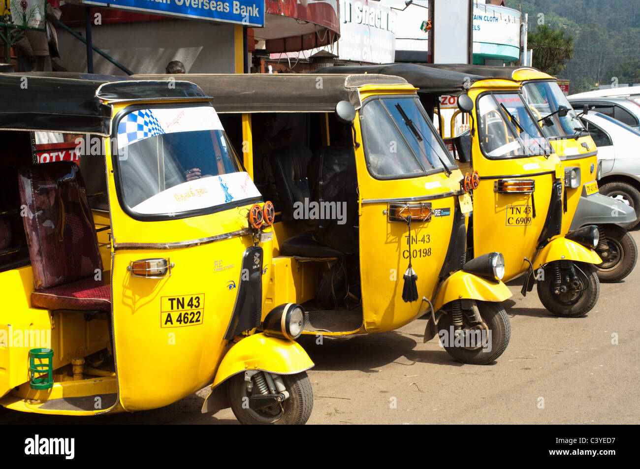 Yellow auto rickshaws lined up in Ooty, Nilgiri Hills, Kerala Stock Photo