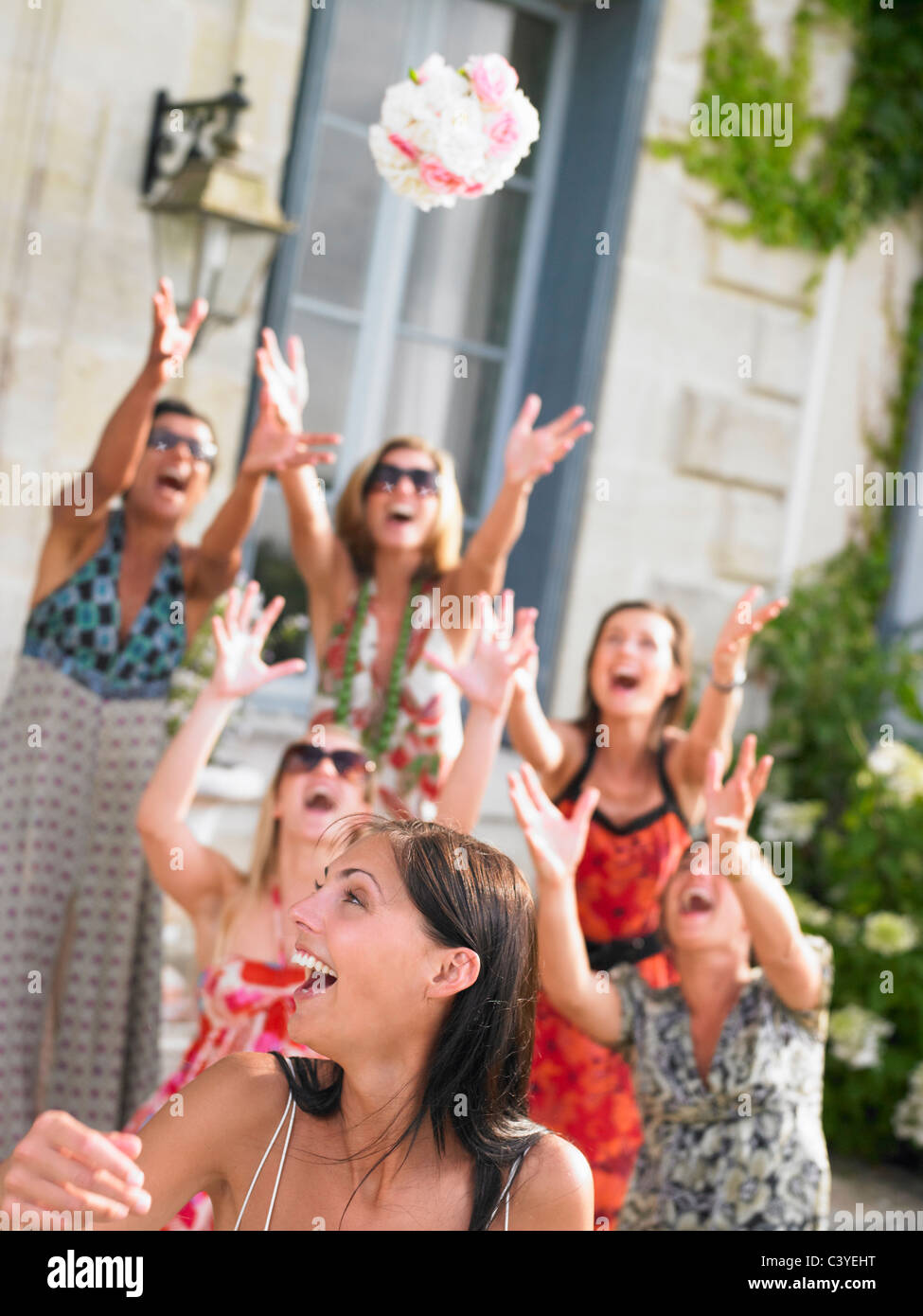 Bride throwing her bouquet Stock Photo Alamy