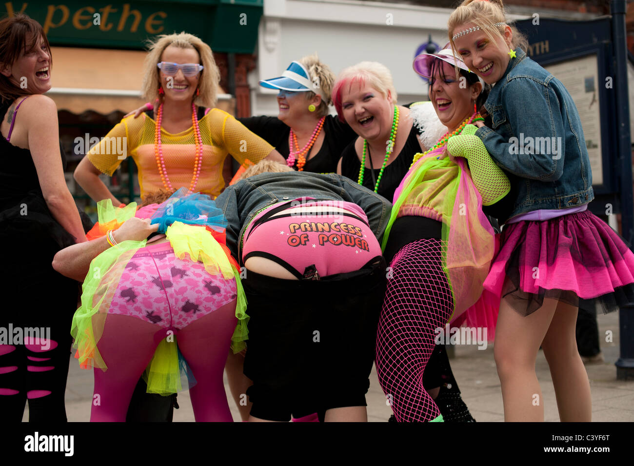 a group of gaudily dressed women on a hen party Aberystwyth Wales UK
