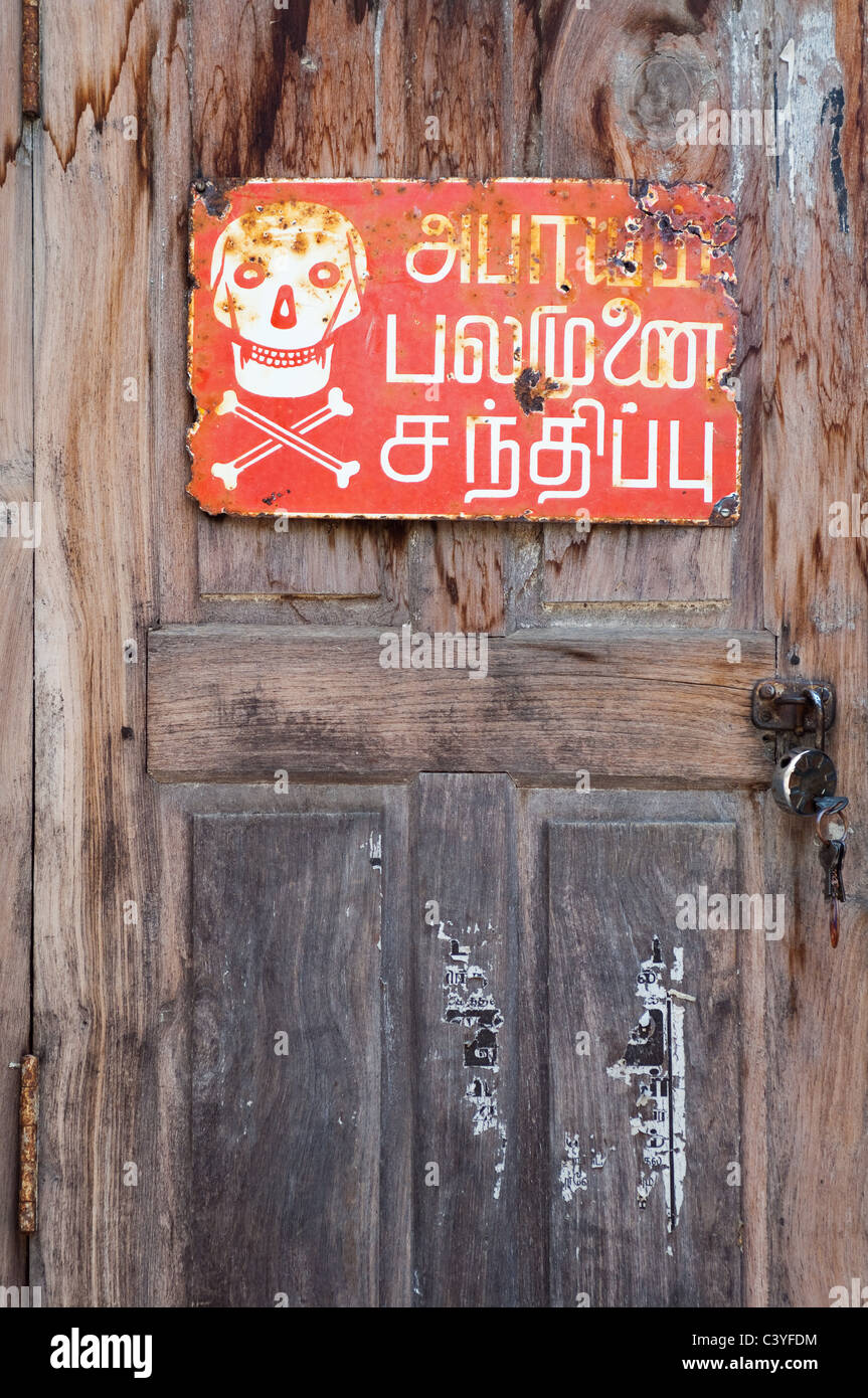 Indian warning sign on wooden door, Tamil Nadu Stock Photo Alamy