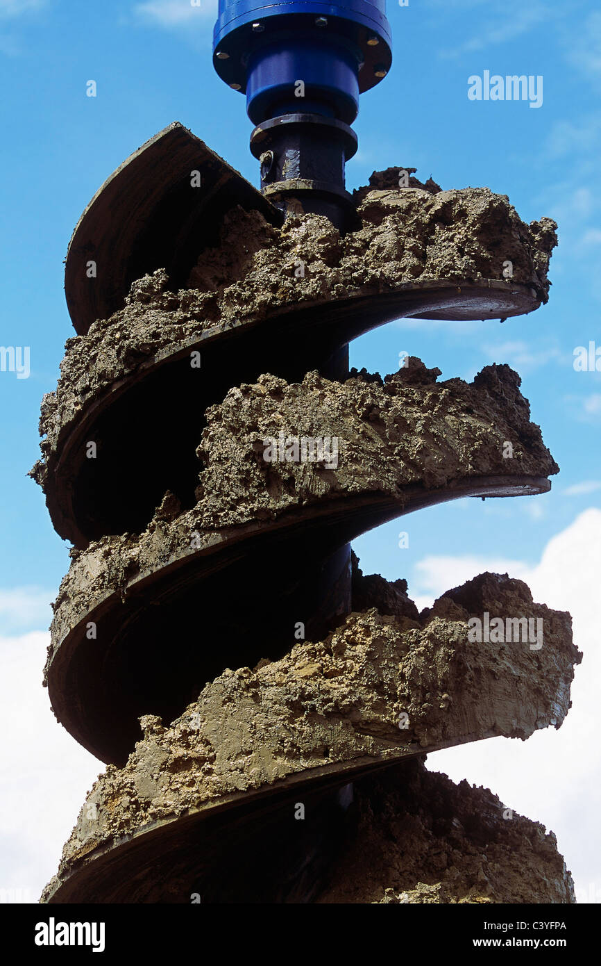 Detail of drill bit covered with mud during bore piling operations