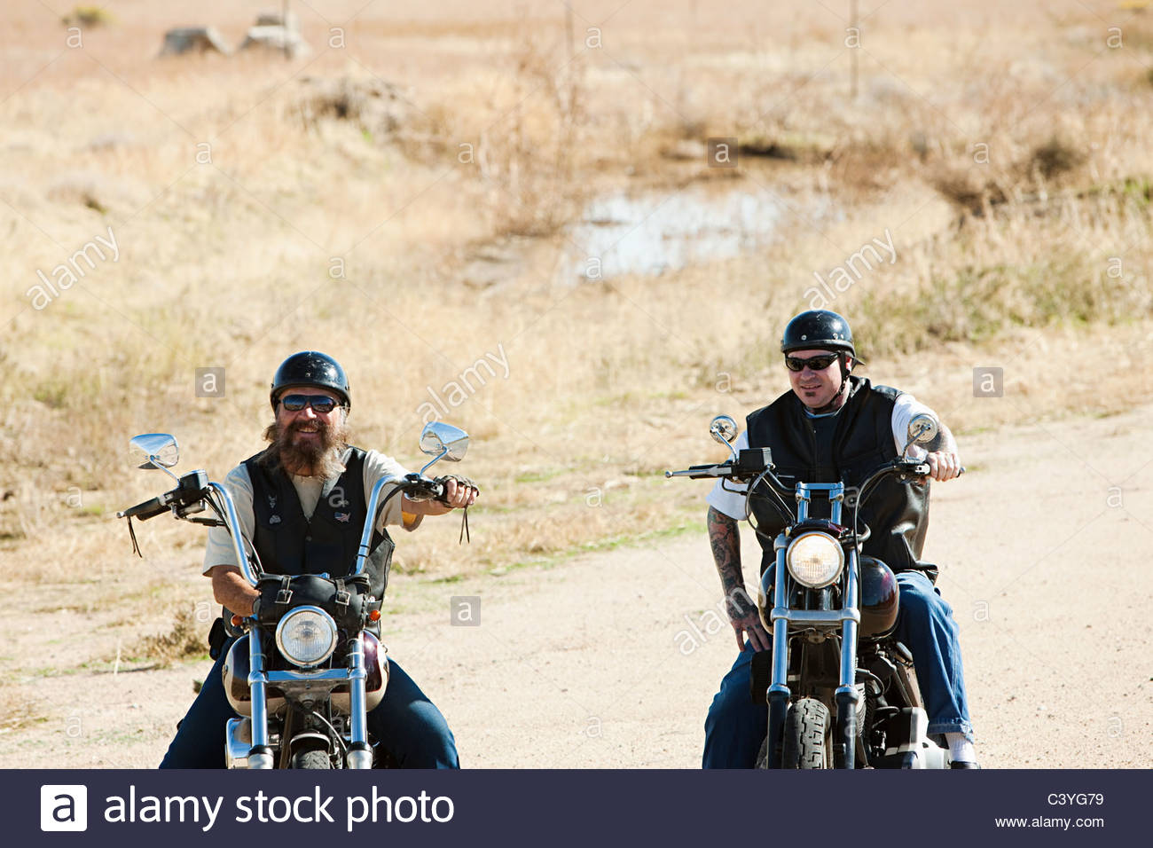 Two Young Men On Motorcycles Stock Photos & Two Young Men On