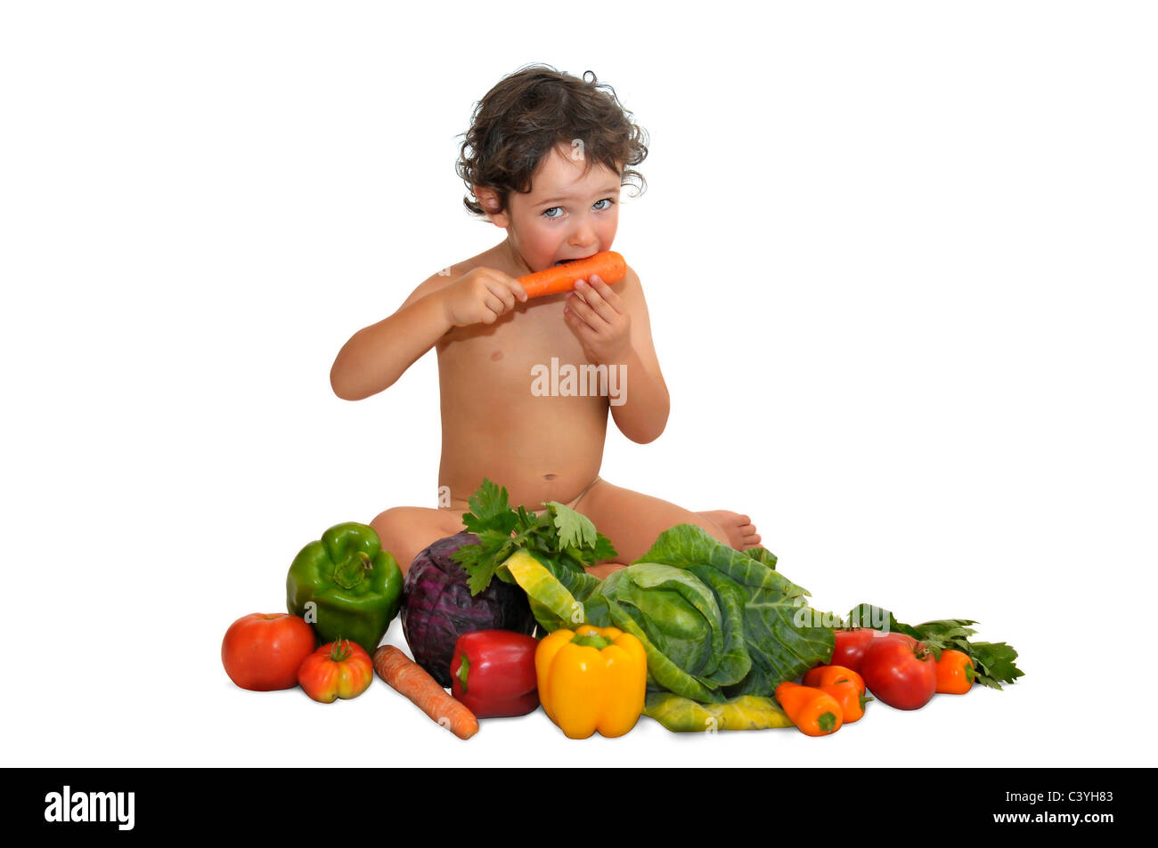 Beautiful young child with vegetables Stock Photo