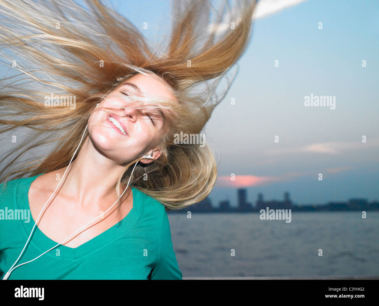 Woman listening to her mp3 player Stock Photo