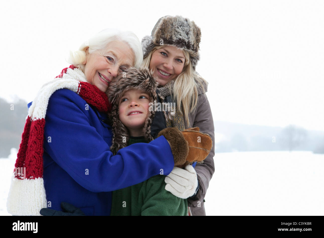 A family portrait in the snow Stock Photo - Alamy