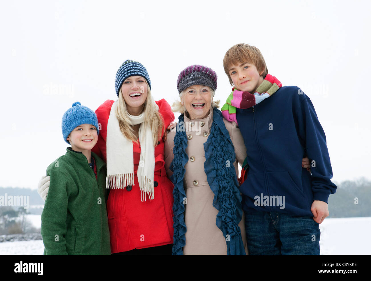 A family portrait in the snow Stock Photo - Alamy