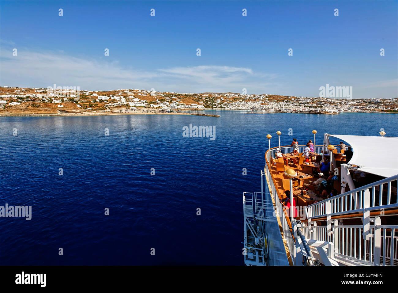 Greece, Mykonos, NCL, Norwegian Cruise Line, cruise ship, Norwegian Gem, leaving port, sailing away, departing, departure, Chora Stock Photo