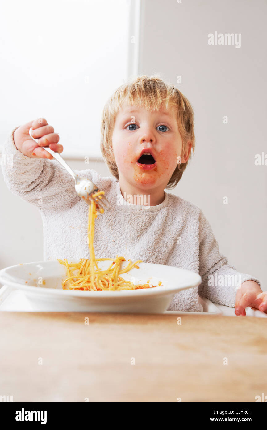 2-year-old-boy-eating-spaghetti-stock-photo-alamy