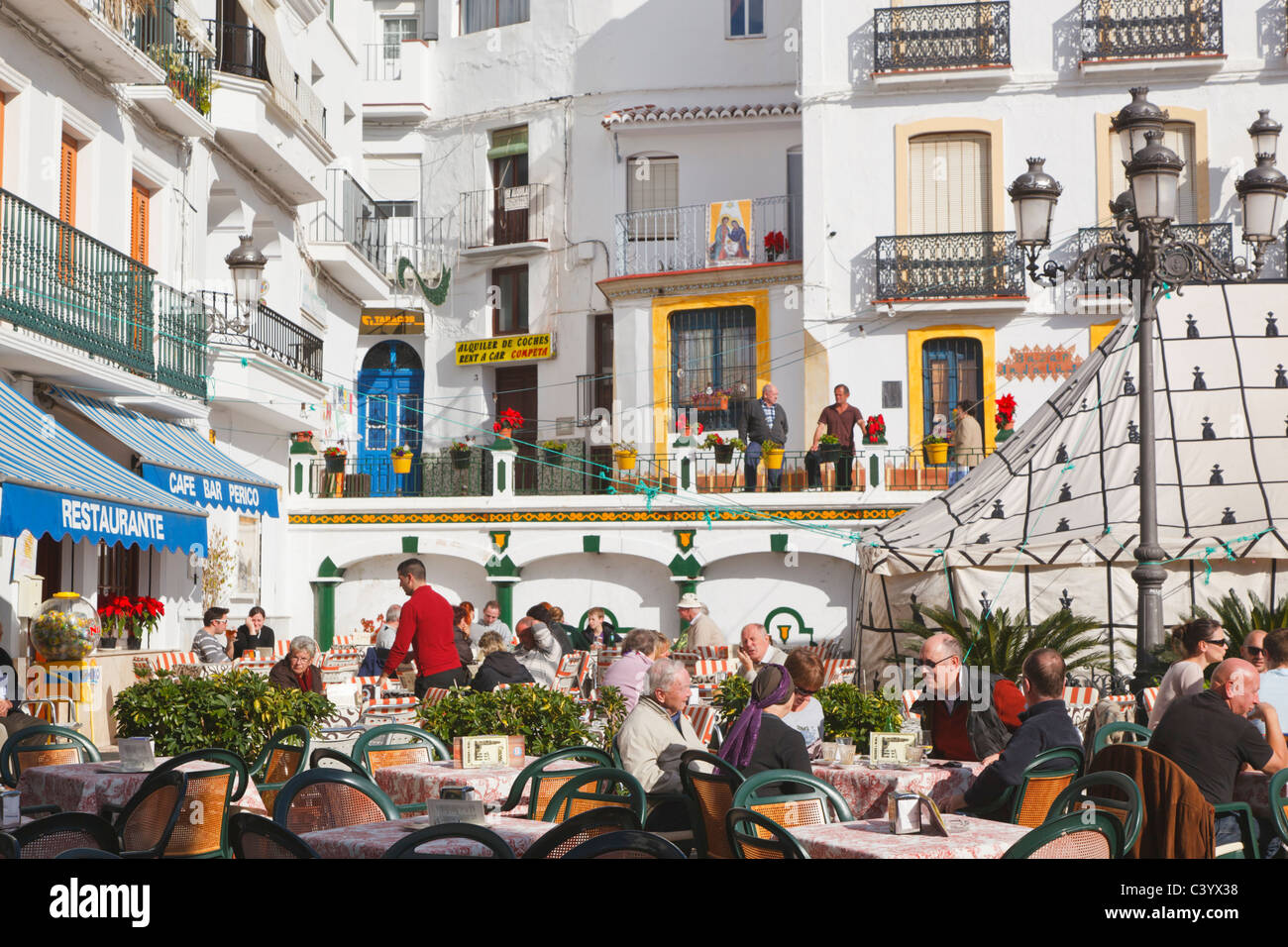 White town of Competa, La Axarquía, Malaga Province, Spain. People at ...